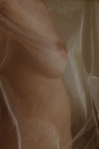 Behind the curtain.