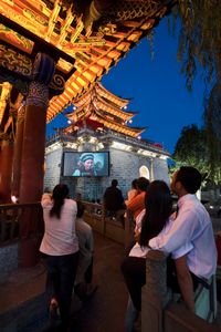 At the centre of Dali old town (Dali Gu Chang), a well-known 1950s movie 'Five Golden Flowers' that was filmed here is shown nightly at the Wu Hua Lou tower.  © Michael Freeman