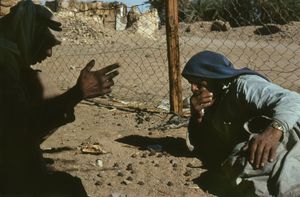 "Juma Playing Game With Camel Dung"