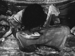 Bedouin Girl Drinking Milk of the Goat