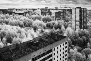 Menace  the horizon - the ill-fated powerstation casts a long shadow over the deserted city of Pripyat © Darren Nisbett