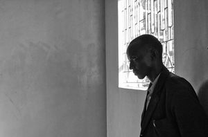 A  young MCF teacher soberly reflects as several of his students recall the 2008 post-election violence and murder in their hometown of Eldoret.                                                                © Lola Reid Allin