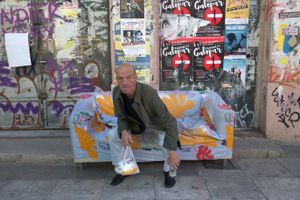 Man on the settee in the street