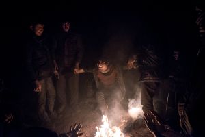 Young Afghan migrants are having fun the evening by the fire, because they were the only warm.