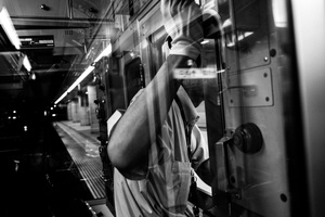 Odakyu staff check the platform during leaveing train in station