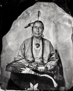Casey Camp-Horinek, citizen of PoncaTribe of Oklahoma, “Zhuthi,” Tribal CouncilWoman, Leader of Ponca Scalp DanceSociety, Sundancer, Delegate to UNPermanent Forum on Indigenous Issues,Matriarch of wonderful family(grandmother, companion, mother, sister),Defender of Mother Earth (2016), CIPX, Photo/Synthesis.