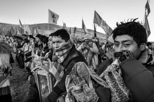 A group of selected dancers withstand the cold while waiting for the first rays of sunlight to fall on the sacred images. Then, the celebrations and dances will begin once again.