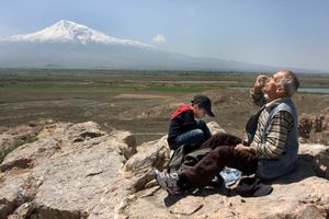 Armenia, grandfather and grandson having a picknick near mt Ararat          © Bert Spiertz
