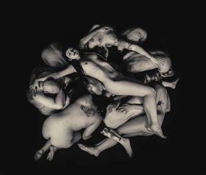 "Deadpool" – is the fifth photograph allegorizing the control of the dark feminine form over all society. The "Witch", the "Temptress", the "Goddess". All bodies underneath are subdued to its power. With the fall from grace, the feminine gains its power through sexuality, while at the same time subdued to society's rules.