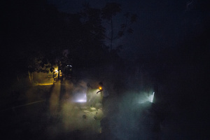 People crossing the hot river to join the Ayahuasca ceremony