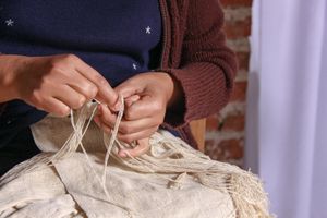 Hands Making Fringe On A Hand-woven Silk Shawl, San Pedro Cajonos Oaxaca Mexico