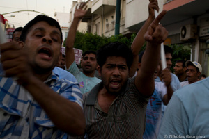 Refugees and migrants shout slogans against racism as the stage a demonstration to protest over racist attacks by neo-nazis. July 5, 2012, Athens, Greece