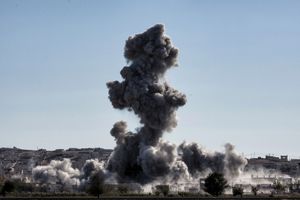 Smoke rises following an airstrike from US-led coalition against IS militants in the Syrian town of Kobane, also known as Ain al-Arab, as it is seen from the Turkish southeastern border village of Mursitpinar, Sanliurfa province, on November 5, 2014.