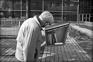 Man at Book Exchange Box