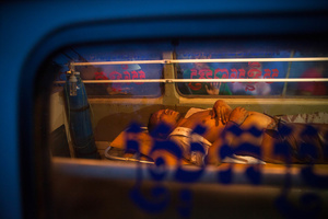 A man lays in an ambulance after being attacked by mob in Phnom Penh’s Stung Meanchey district when he was mistaken to be Vietnamese.