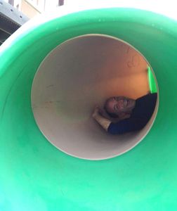 Steve in a slide at the park