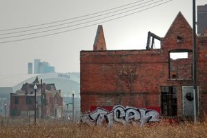 © Nicholas Gregory.     Four blocks from the revitalized Midtown district, this uninhabitable structure is one of the thousands within walking distance from sports stadiums and four-star restaurants. Six straight decades of declining population has left 80,000 abandoned buildings scattered throughout Detroit.