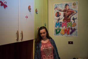 Rosa Visalli, 18 years old, poses inside her room. She is a great fan of Mimmo Dany.
