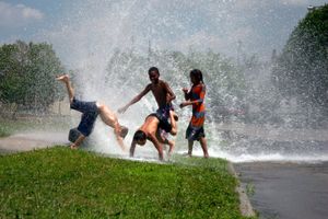 © Nicholas Gregory.     Children from Detroit's East side cool off on a hot summer day with the help of a fire hydrant. As public recreation centers close due to a lack of funding, kids find new ways to have fun.