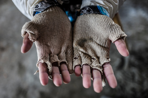 Close up of the hands of a female construction worker.