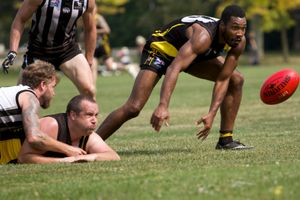 Stephen Walker after a loose ball while Mike Visser gets floored.