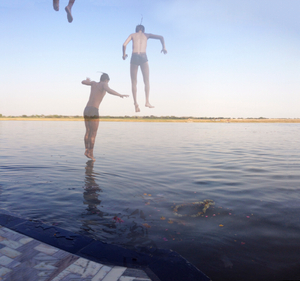 Boys jump into the Ganges