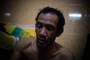 Into The Dark: Scenes From South East Asia's Meth Epidemic. An addict in a hotel room, Poipet, Cambodia.