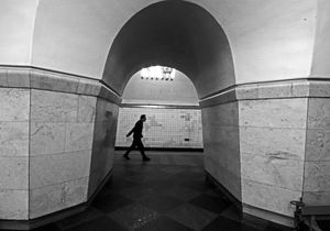 'Man Dwarfed by Soviet Metro Architecture'