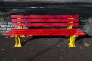 Three red benches with yellow legs by the river Rhein, St. Goar, 2011