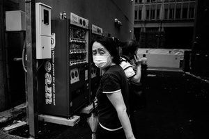 A lady with a mask walk in Shinjuku