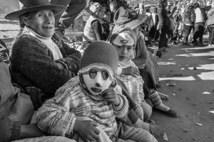 Young spectators dressed as the dancers from their community.