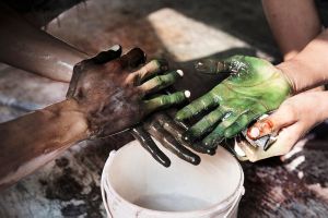 Workers wash their hands after working on batik, Central Java.