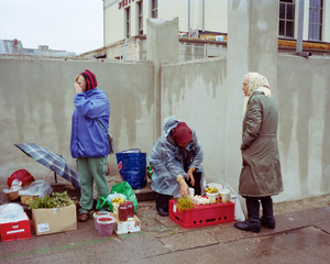 Old women selling fruits and eggs from their garden at the entrance of Kalvariju market, Vilnius, Lithuania, September 2015.