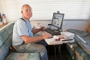 Roger Catches up on Facebook. Quartzsite, AZ.   ©David Gardner
