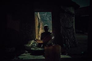 Woman in her hut.