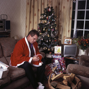 Jon Ison at home in Birmingham, waiting for his child, who never arrived to celebrate Christmas. Birmingham, UK. 25 December 2011