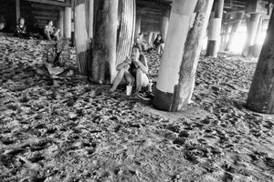 Young Woman Under The Santa Monica Pier