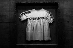 Dress of Venceslava Krasova, Lidice child who was poisoned by exhaust gas in specially adapted vehicles in the Nazi extermination camp at Chełmno upon Nerr in Poland.