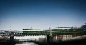 DART (train) passing over the river.