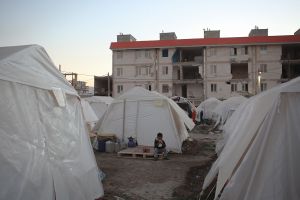 A kid in front of his camp