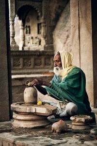 Varanasi, India: A Sadhu during his ritual puja in his Shiva Temple. © Matjaz Krivic