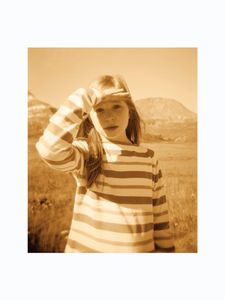 Girl with hand in front of her eyes