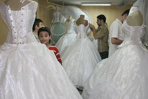 A Boy at dress factory