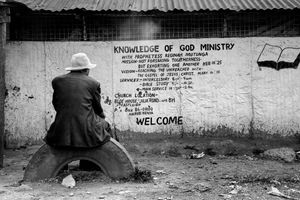 © Tony Corocher - Disillusion…- Come to church and "the knowledge of God Ministry" will save you from desperation! Welcome to Mathare!!!When I saw this man I immediately pictured him as someone who had seen it all, someone who knew that with or without religion there is no easy way out… Complete, total poverty pushes men to believe, just in order to have a little hope. Right or wrong, it is still