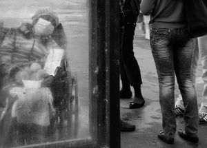 Behind the glass.