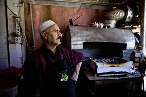 A shishkebab restaurant owner in his kitchen in the city of Haj Omaran, next tot the Iranian border. © Tom Verbruggen