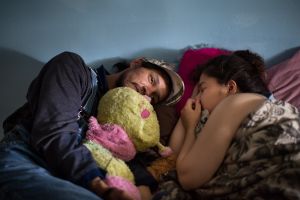Xavier and Miranda lay in bed