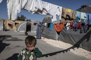 Kurds refugees from Kobane living inside a factory used as refugee camp, known as Suphi Nejat Agirnasli in the town of Suruc, Sanliurfa province, Turkey on November 9, 2014.
