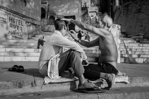 Street barbershops in the Ghat.