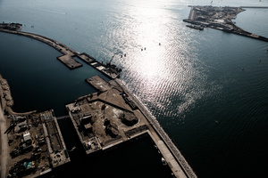 The MOSE project flood gates will soon be installed on all three lagoon inlets. Lido, Malamocco and Chioggia. The gates will rise to prevent high tides flooding the lagoon. In October 2012, the concrete caissons that will host the gates were already installed on the Lido inlet seabed. Work underwater was underway. Workers descended to the caissons through shafts seen here emerging out of the water